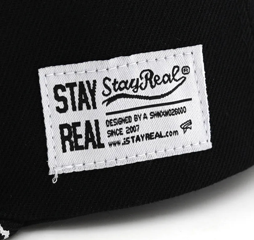 Cotton baseball hat with letter embroidery showing dome crown and adjustable strap in black and white colour options