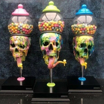Spooky skull-shaped candy dispenser with transparent brain-shaped compartment and candy on the tongue, perfect for Halloween decor