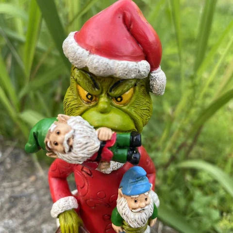 Festive outdoor decoration featuring the Grinch and a group of whimsical garden gnomes, made from durable resin with a vibrant hand-painted finish.