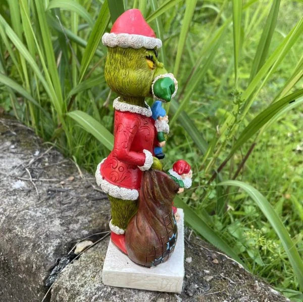 Festive outdoor decoration featuring the Grinch and a group of whimsical garden gnomes, made from durable resin with a vibrant hand-painted finish.