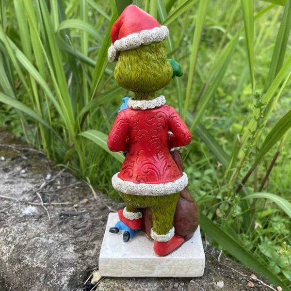 Festive outdoor decoration featuring the Grinch and a group of whimsical garden gnomes, made from durable resin with a vibrant hand-painted finish.