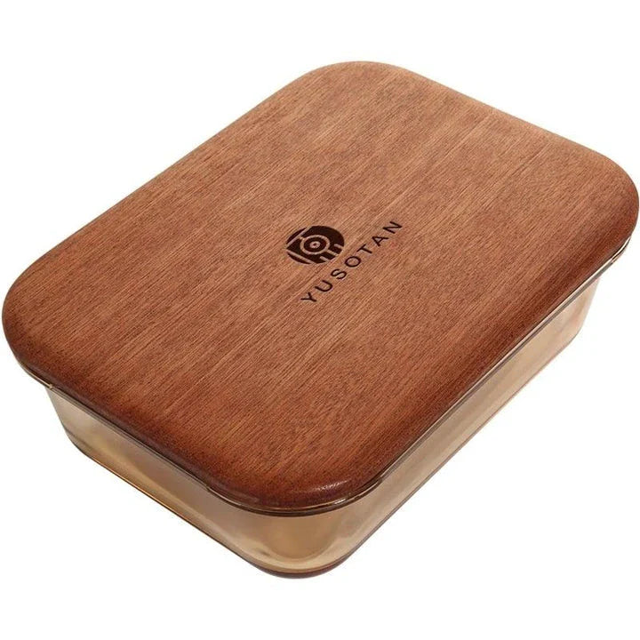 A wooden lunch box with a glass bowl, perfect for kids to bring their meals to school
