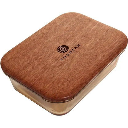 A wooden lunch box with a glass bowl, perfect for kids to bring their meals to school