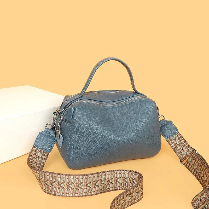 Luxurious genuine leather crossbody bag for women, featuring a soft, compact design with dedicated phone pockets and an adjustable strap for versatile wear.