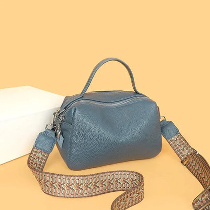 Luxurious genuine leather crossbody bag for women, featuring a soft, compact design with dedicated phone pockets and an adjustable strap for versatile wear.