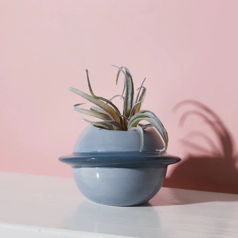 Mini planet-shaped ceramic succulent flower pot in blue color, ideal for indoor and outdoor use