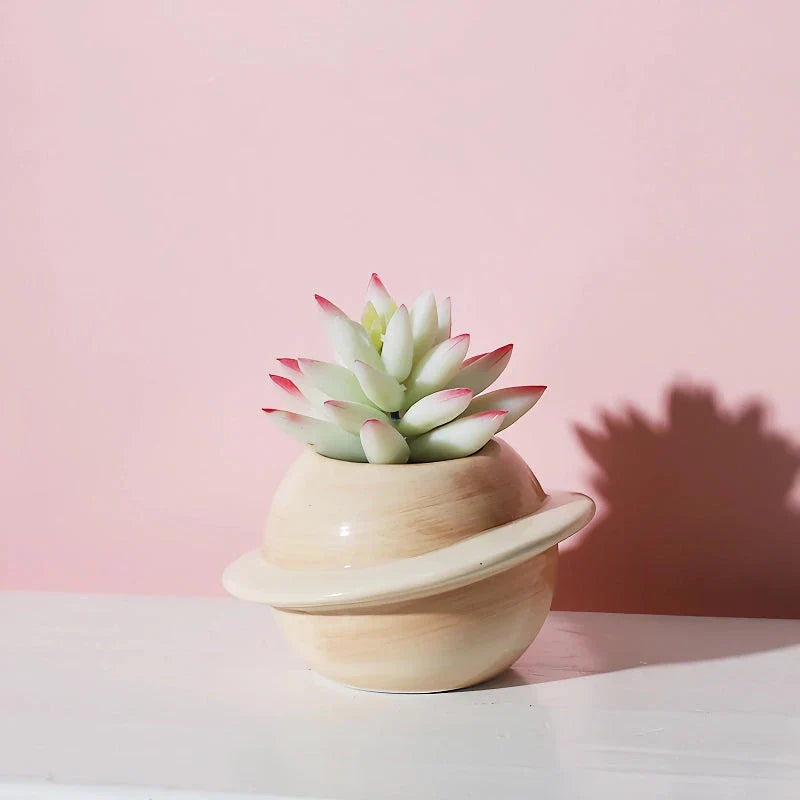 Mini planet-shaped ceramic succulent flower pot in blue color, ideal for indoor and outdoor use