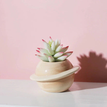 Mini planet-shaped ceramic succulent flower pot in blue color, ideal for indoor and outdoor use