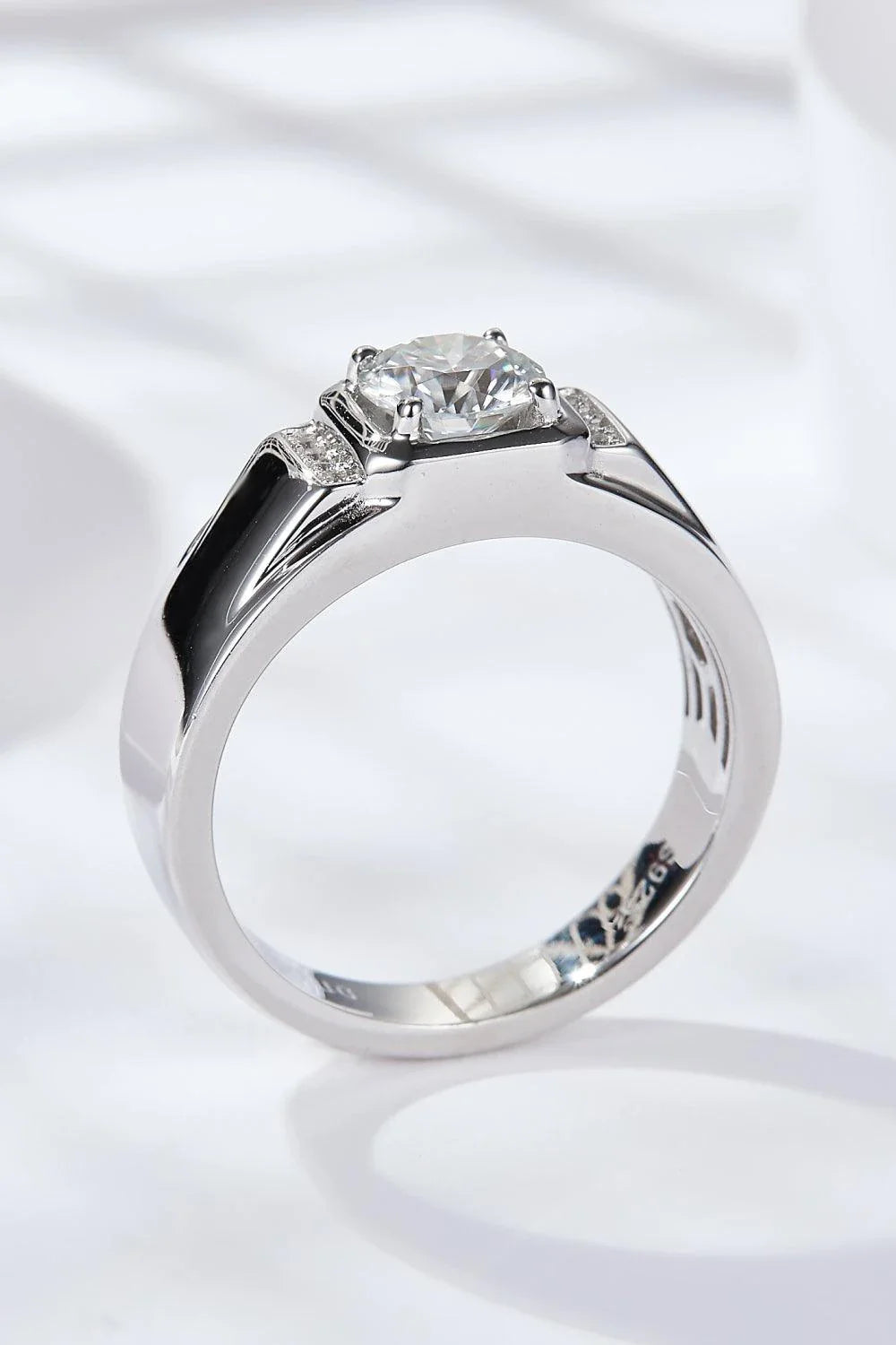 Trendha 1 carat moissanite ring in 925 sterling silver with platinum plating, a minimalist design perfect for engagements or everyday wear.
