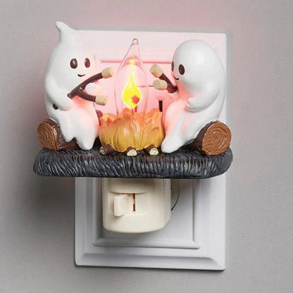 A spooky yet adorable nightlight featuring a friendly ghost enjoying a cozy campfire, creating a warm and soothing ambiance for any room.