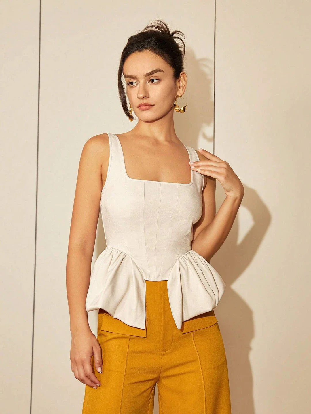 Chic square neck asymmetrical hem top in beige color, featuring a structured fit and premium polyester blend fabric for elevated style and comfort.
