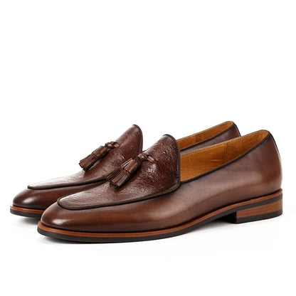 Premium British-inspired men's business casual loafers made from top-grain cowhide leather with a classic tassel design and shock-absorbing sole