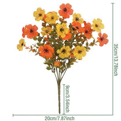 Autumn coloured artificial flower bouquet with plastic and silk flowers for decoration.