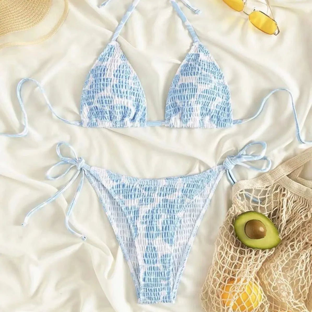 Women's floral halter neck swimsuit set in polyester fabric showing bra top and briefs