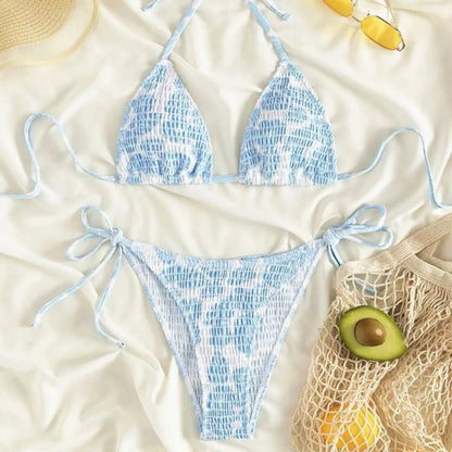 Women's floral halter neck swimsuit set in polyester fabric showing bra top and briefs