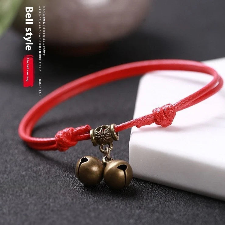 Adjustable nylon rope dog collar with brass bell in black, red, and coffee colour options