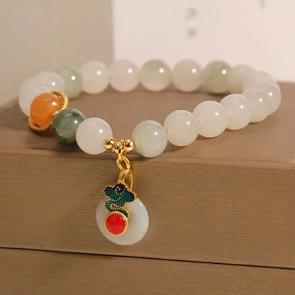 Ice jade crystal bracelet for women with Xiangyun peace jade buckle and pearl accents.
