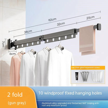 Aluminum retractable drying rack mounted on a window, extending outward for clothes drying