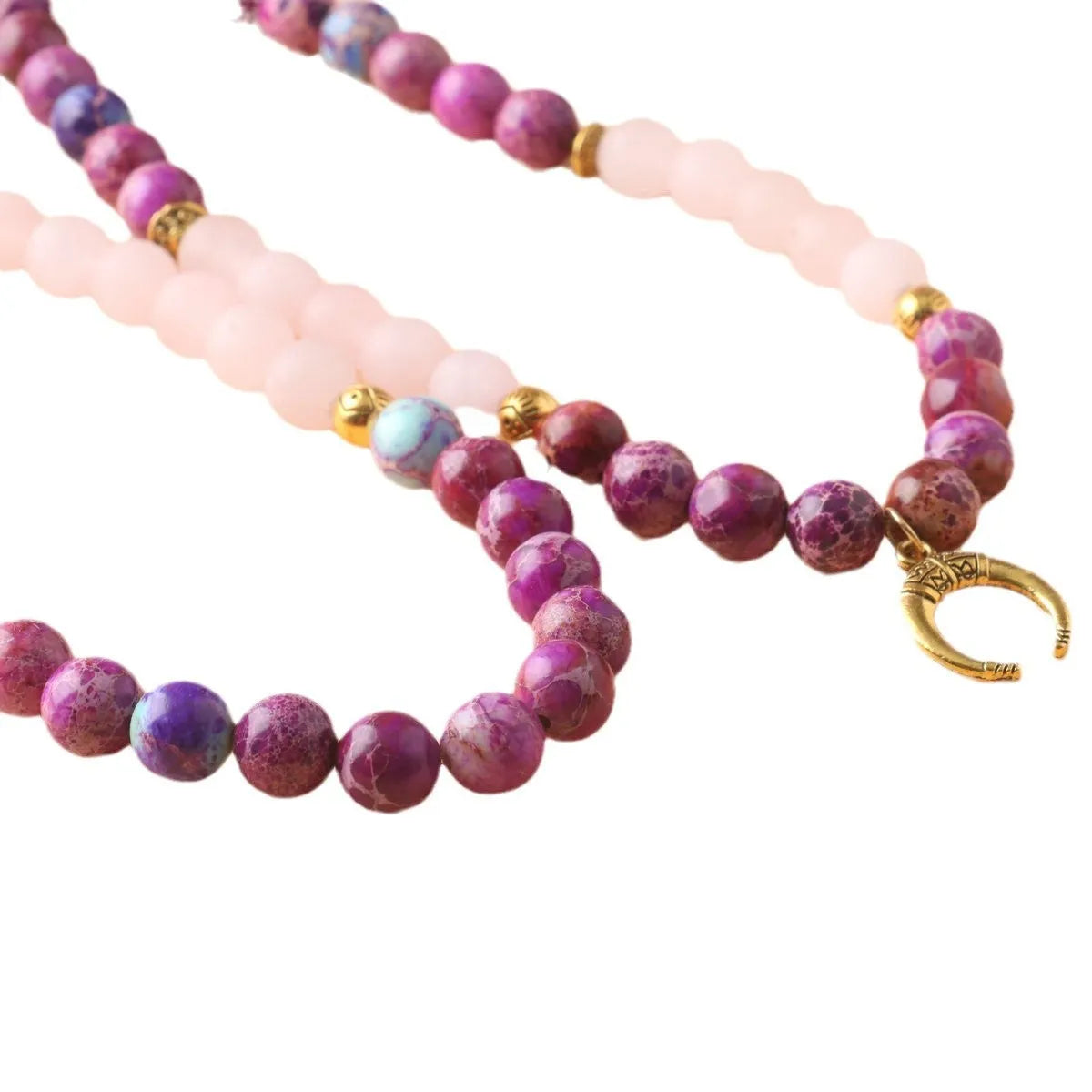 Round pink crystal emperor stone bead pendant on a women's personalised necklace.