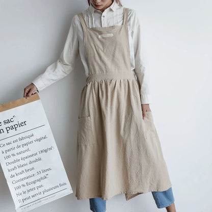 Sleeveless cotton kitchen apron in blue colour showing front coverage and adjustable neck strap