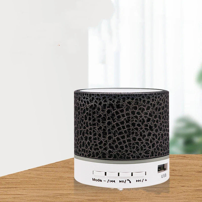 Portable Bluetooth speaker with colorful LED lights, offering impressive sound quality and convenient features for on-the-go music enjoyment.