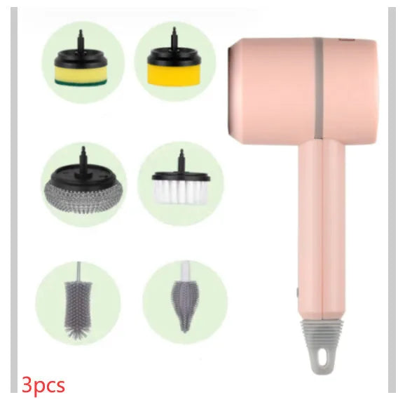 Green electric cleaning brush with scouring pad and brush heads on a kitchen worktop.