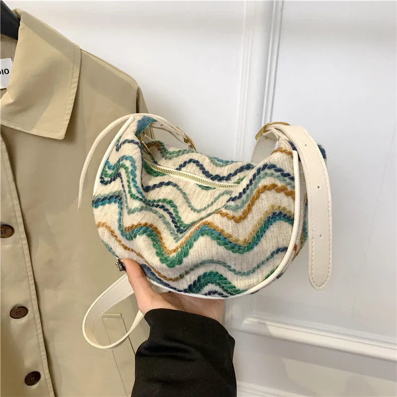 Women's woven straw crossbody bag with internal phone and file pockets in various colours.