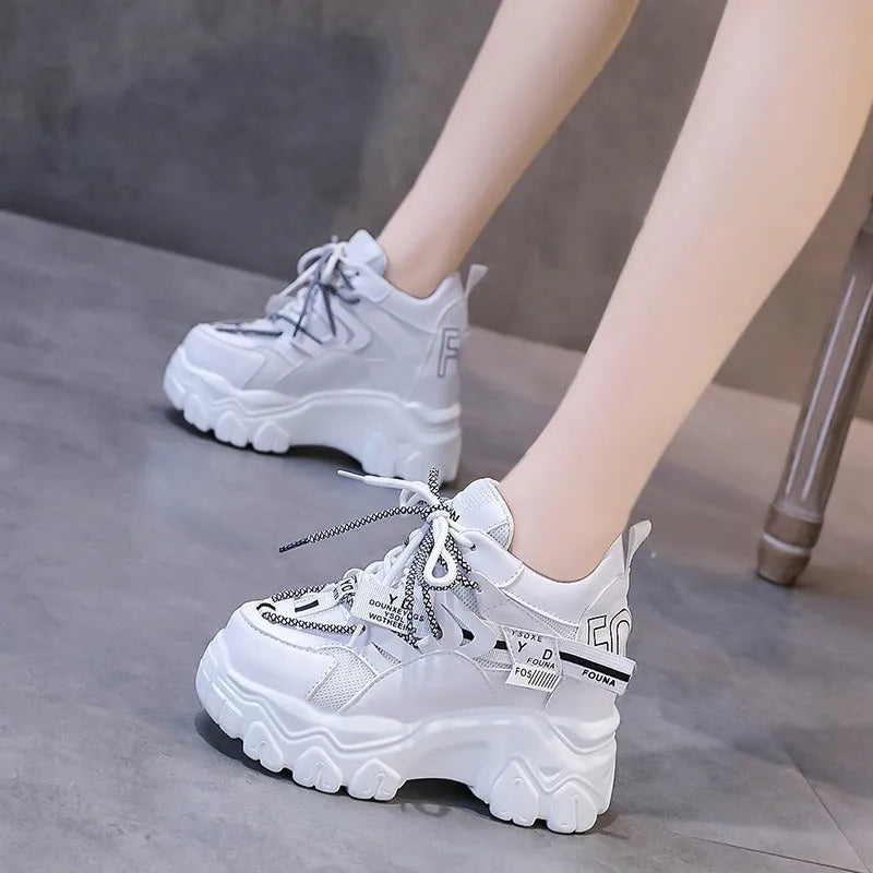 Women's white breathable mesh platform sports shoes with cross-strap detail and rubber sole