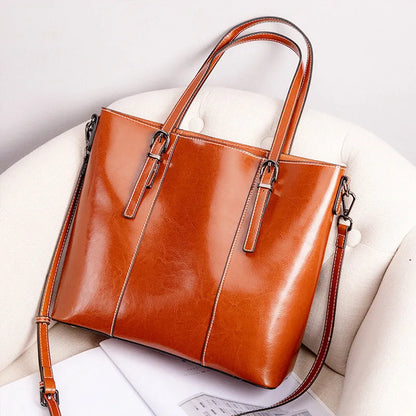 Brown genuine leather women's retro shoulder bag showing front view and organised interior pockets.
