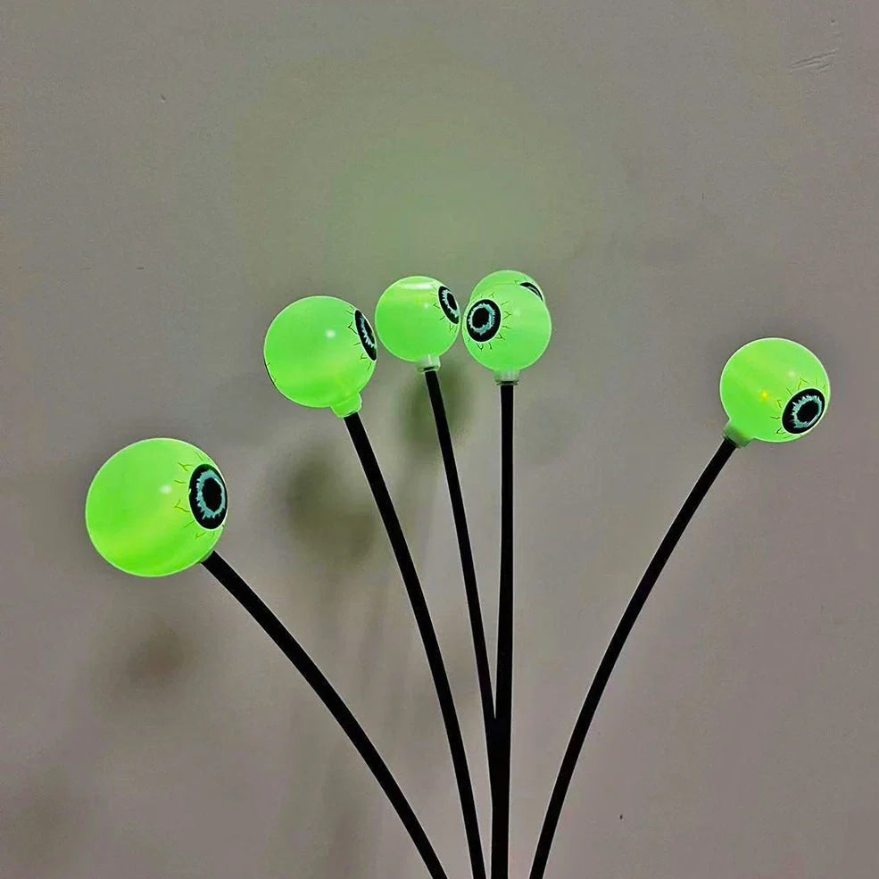 Solar-powered Halloween string lights with detailed eyeball design for outdoor garden decoration
