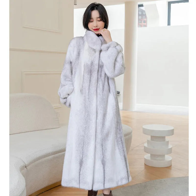 White women's faux fur coat with a stand-up collar, shown on a model.