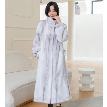 White women's faux fur coat with a stand-up collar, shown on a model.