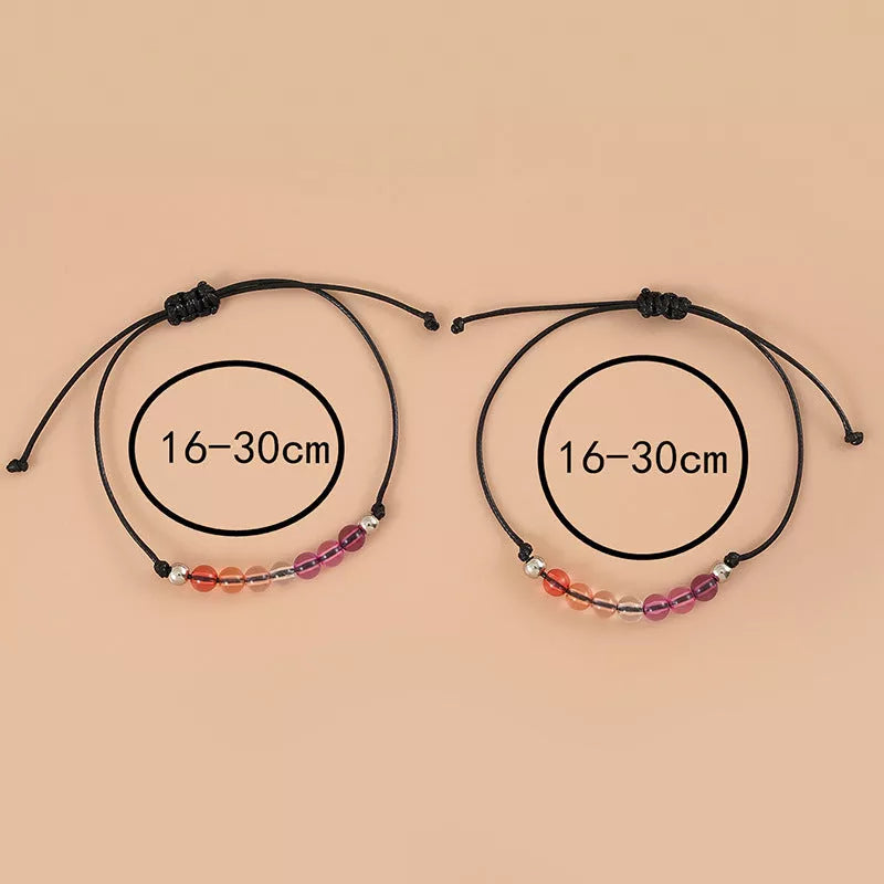 Adjustable purple acrylic beaded bracelet with bisexual couple card