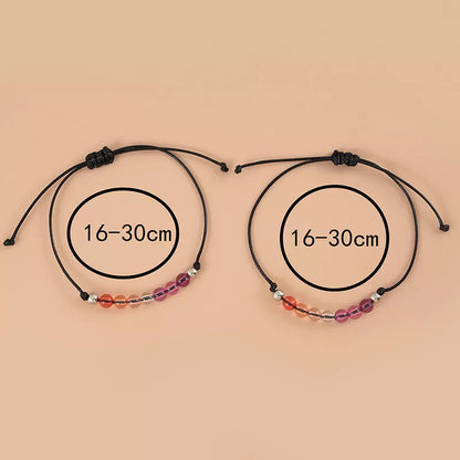 Adjustable purple acrylic beaded bracelet with bisexual couple card