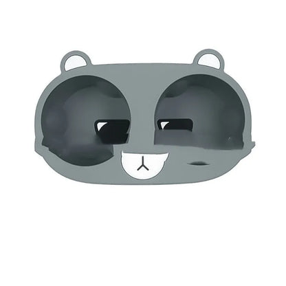 Flexible grey silicone car cup holder insert with a raised cartoon animal design for the centre console.
