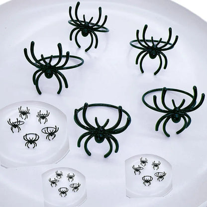 Six black spider-shaped alloy napkin rings with electrophoresis coating for Halloween table settings
