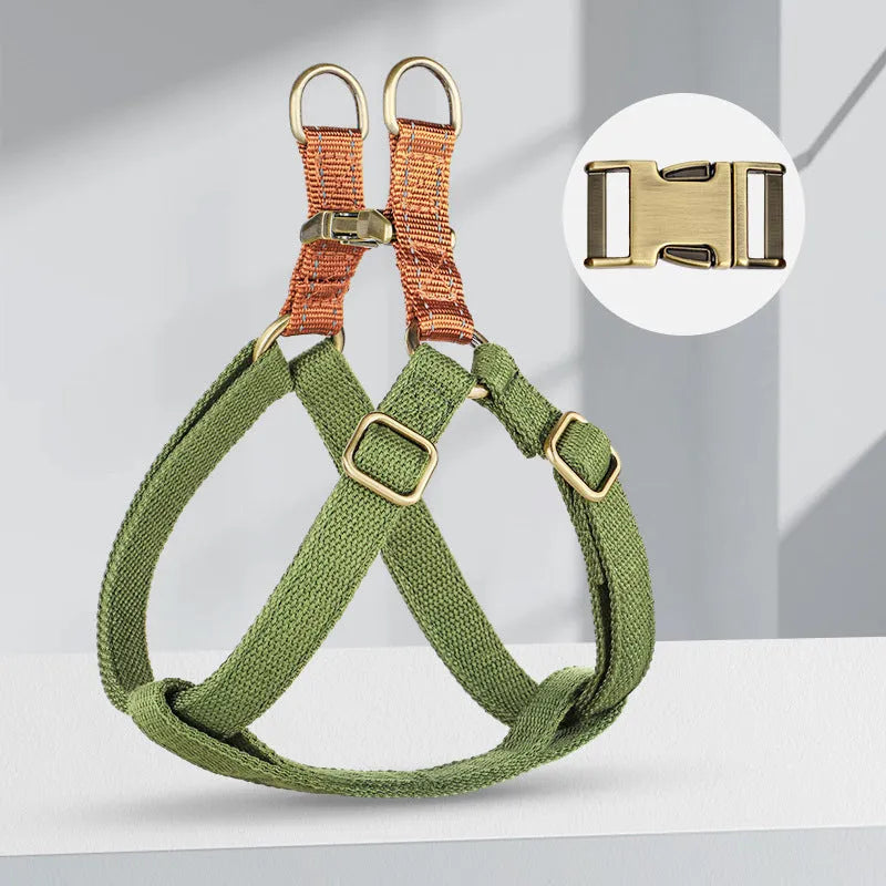 Brown vest-style dog leash with chest harness and alloy fastener on a dog.