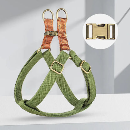 Brown vest-style dog leash with chest harness and alloy fastener on a dog.
