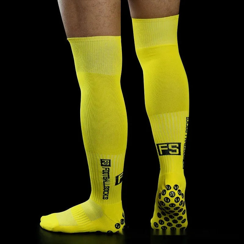 Anti-slip dispensing knee-length football socks in polyester, available in ten colours including black, white, red, and blue.
