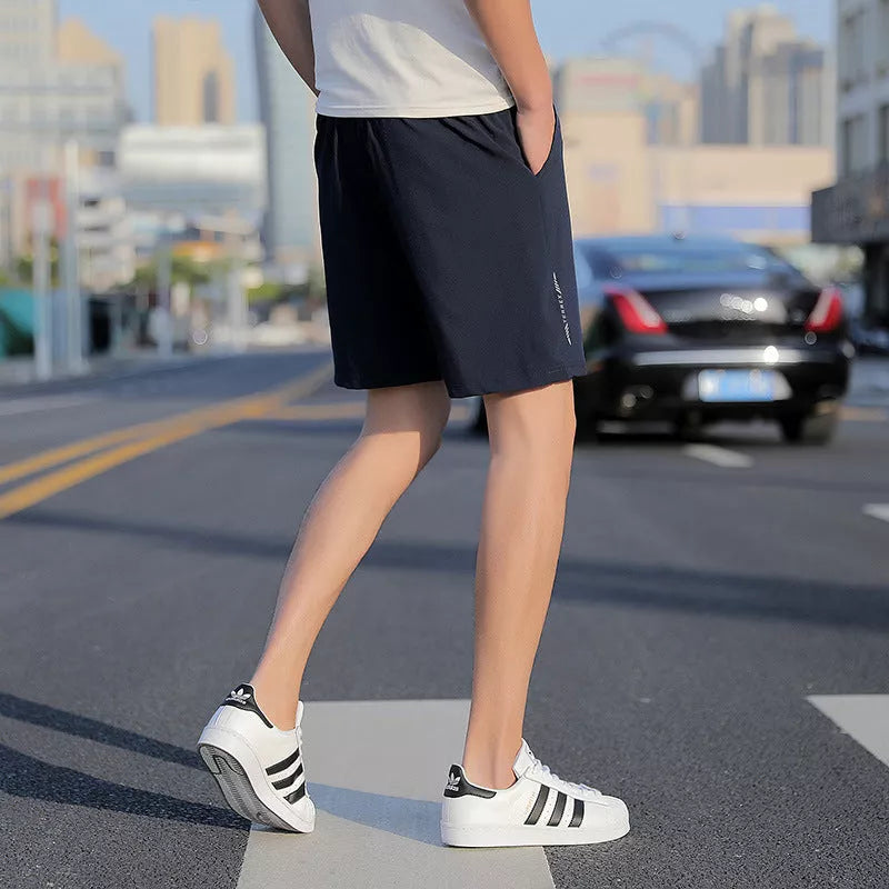 Men's Five-point Sports Shorts in quick-drying cotton, available in gray, black, and blue