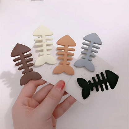 Minimalist fishbone pattern hair barrette in a candy colour with duckbill clip design.