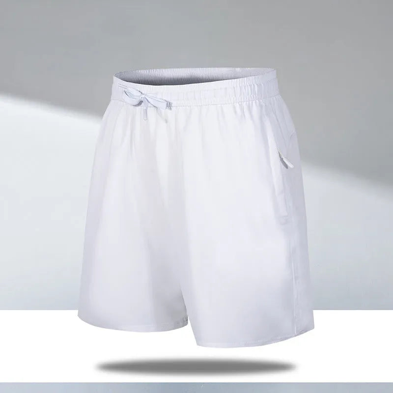 Man wearing black loose-fit ice silk sports shorts with a micro-elastic waistband, suitable for running or casual summer wear.