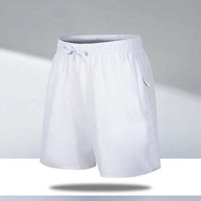 Man wearing black loose-fit ice silk sports shorts with a micro-elastic waistband, suitable for running or casual summer wear.