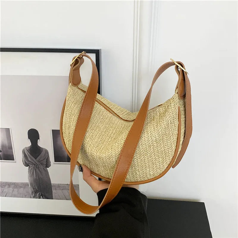 Women's woven straw crossbody bag with internal phone and file pockets in various colours.