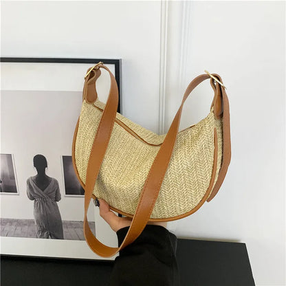 Women's woven straw crossbody bag with internal phone and file pockets in various colours.