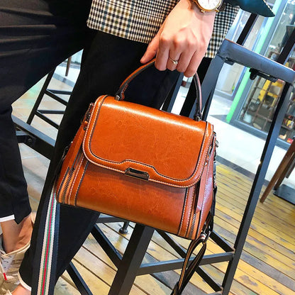 Women's genuine leather retro messenger bag in horizontal square shape with multiple internal compartments