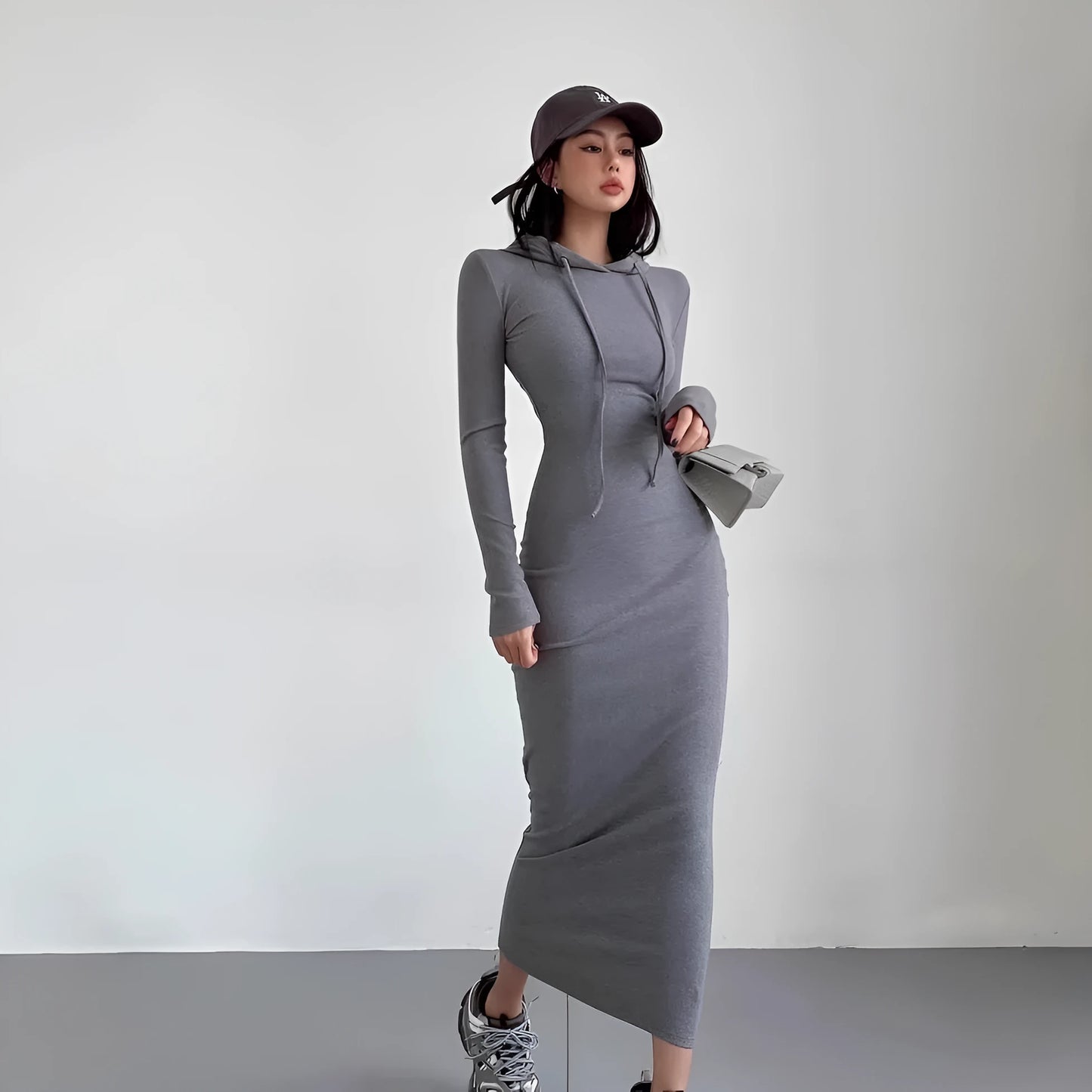 Women's sheath over-the-knee dress with hood and long sleeves in polyester, available in multiple colours