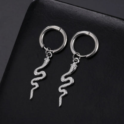 Gold coloured snake-shaped vintage clip-on earrings made from stainless steel.