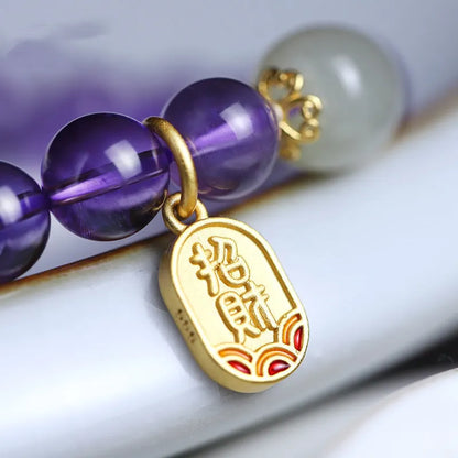 Purple amethyst crystal bead bracelet with geometric shape on an adjustable chain.