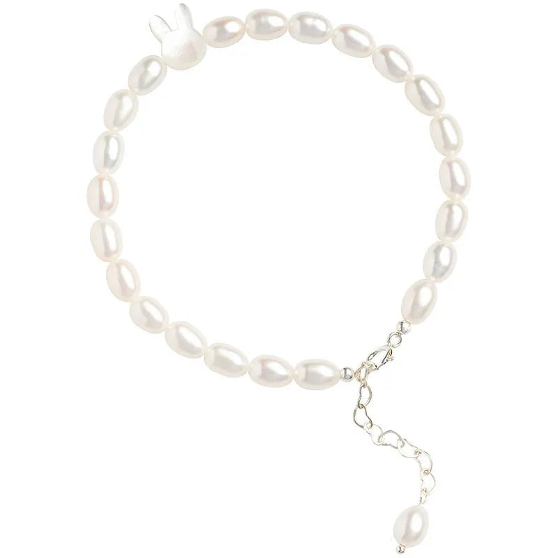 White pearl bead bracelet with silver rabbit charm on elastic string